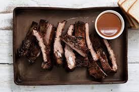 Dreamland BBQ signature dishes Hickory-Smoked Ribs, BBQ Pork Sandwich, Banana Pudding